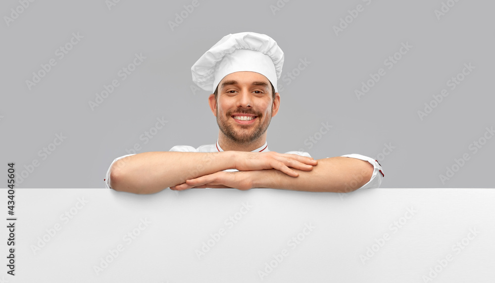 cooking, culinary and people concept - happy smiling male chef in toque with big white board over grey background cooking, culinary and people concept - happy smiling male chef in toque with big white board over grey background