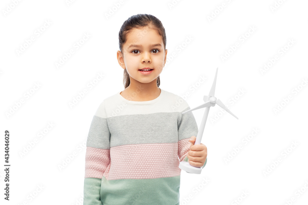 sustainable energy, power and people concept - happy smiling girl with toy wind turbine over white background sustainable energy, power and people concept - happy smiling girl with toy wind turbine over white background