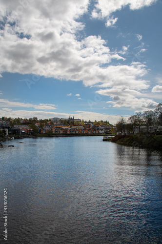 View of Trondheim with NTNU (Technical College) in the background the river Nidelva silently floats in the foreground. Vertical photo.