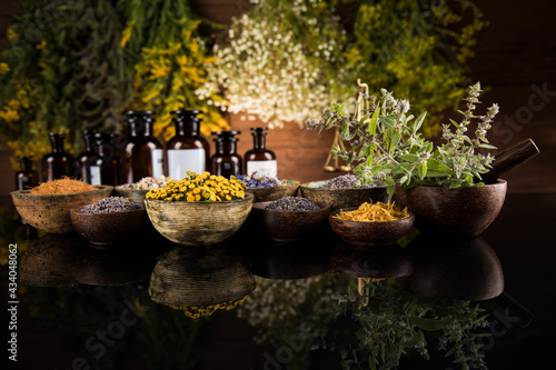 Black mirror background  Natural remedy  healing herbs