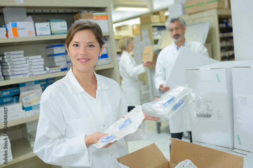 hospital pharmacist with newly delivered supplies hospital pharmacist with newly delivered supplies