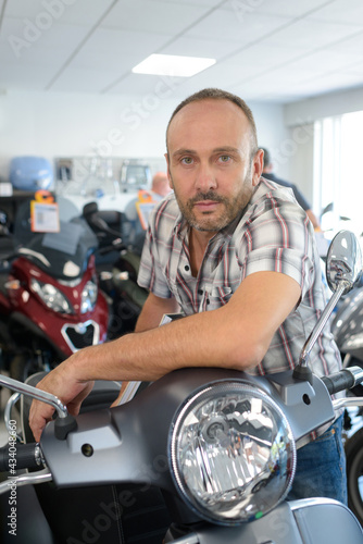 a man with motorcycle workshop