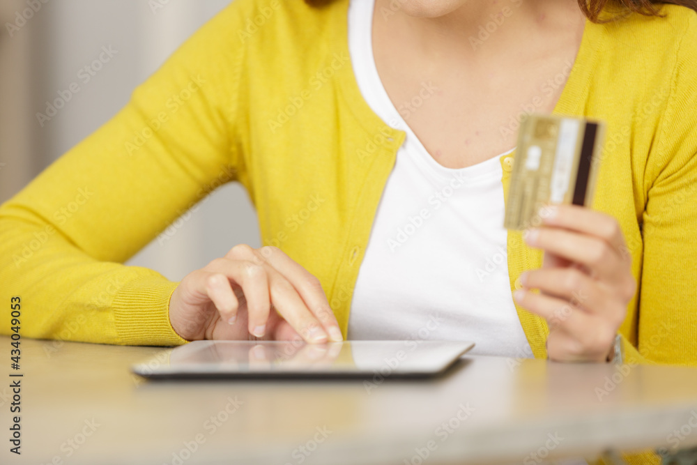 woman shopping using tablet pc and credit card woman shopping using tablet pc and credit card
