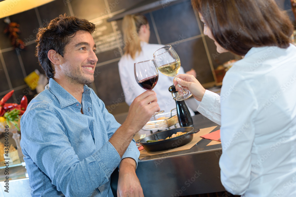 a happy couple drinking wine a happy couple drinking wine
