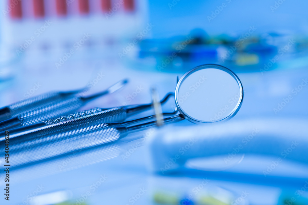 Dentist equipment on blue background Dentist equipment on blue background