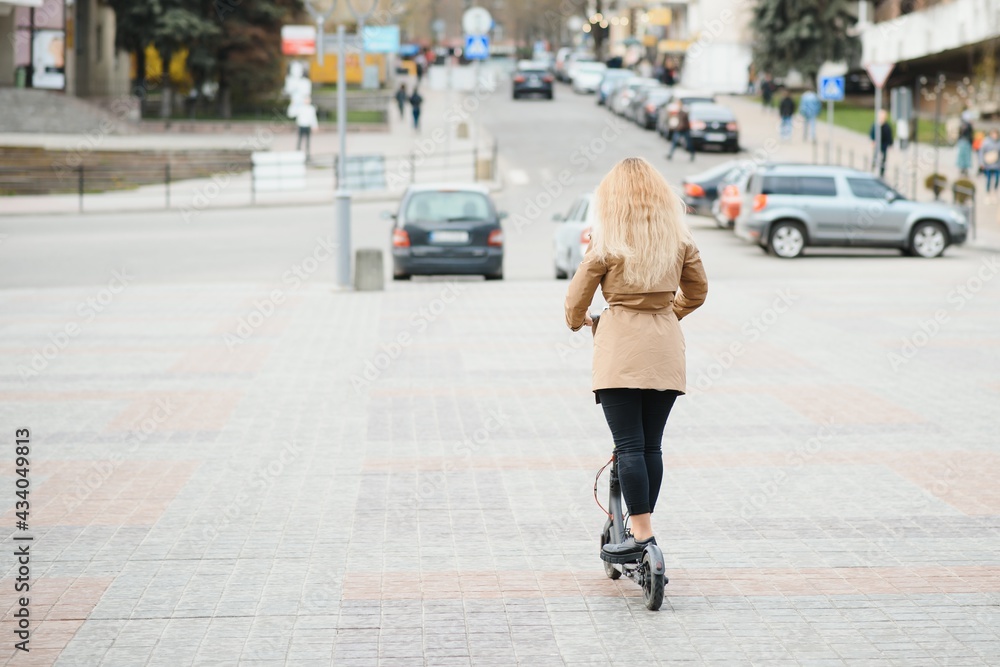 Portrait of a young woman with electro scooter Portrait of a young woman with electro scooter