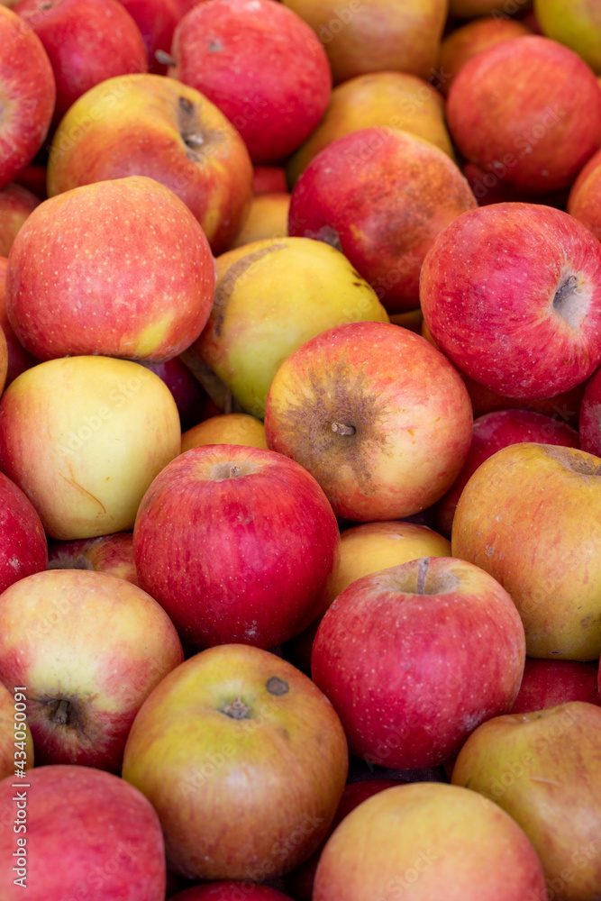 Fresh red apples in the market. Red apples in bulk. ripe red apples in a street market Fresh red apples in the market. Red apples in bulk. ripe red apples in a street market