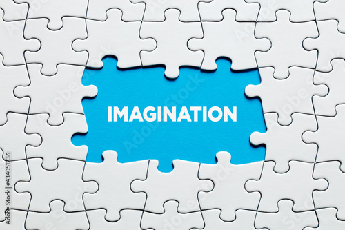 Fotografie The word imagination surrounded by jigsaw puzzle