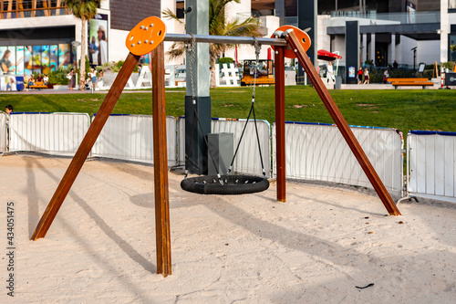 Photography Empty kids swings at JBR beach in Dubai