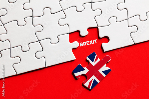 Missing puzzle piece with Great Britain flag exits the European Union. Brexit.
