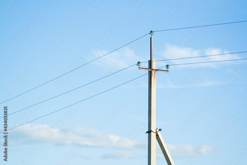 Clear electric post on blue sky on sunny day Clear electric post on blue sky on sunny day
