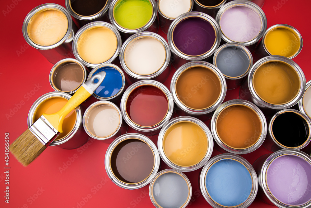 Paintbrush on cans with color Paintbrush on cans with color