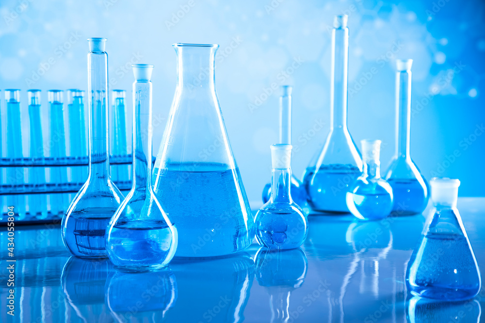 Laboratory beakers,Science experiment, blue background Laboratory beakers,Science experiment, blue background