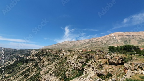 Beautiful village near the valley. Aerial image of the city and valley. Best hiking trails. Middle East country. Summer vacation in Lebanon. Travel trip.