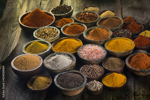 Aromatic spices on wooden background