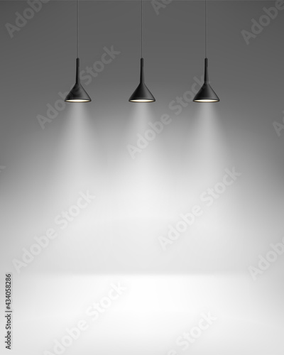 Empty room with three bright lamps