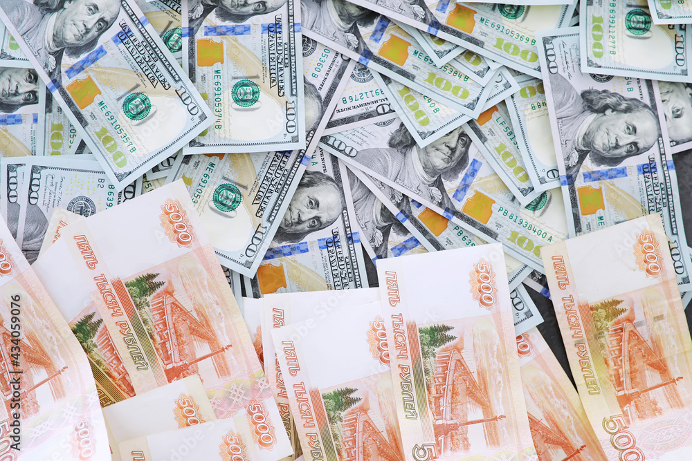 Fototapeta premium Group of money stack of 100 US dollars banknotes a lot of the background texture. Cash money in a large pile as a finance background.