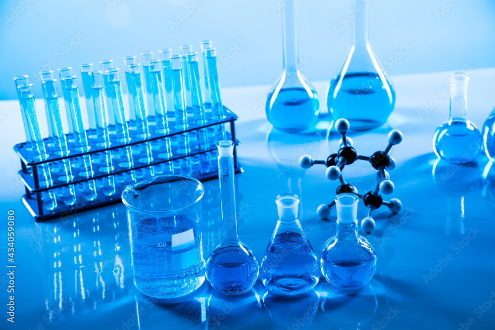 Laboratory beakers,Science experiment, blue background Laboratory beakers,Science experiment, blue background