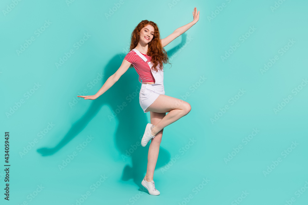 Full length body size view of lovely cheerful girl dancing having fun like plane flight isolated bright blue color background Full length body size view of lovely cheerful girl dancing having fun like plane flight isolated bright blue color background