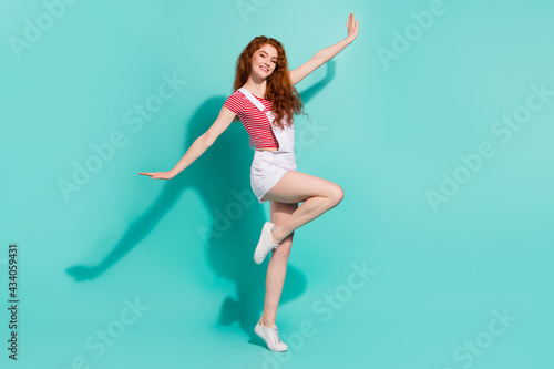 Fototapeta Naklejka Na Ścianę i Meble -  Full length body size view of lovely cheerful girl dancing having fun like plane flight isolated bright blue color background