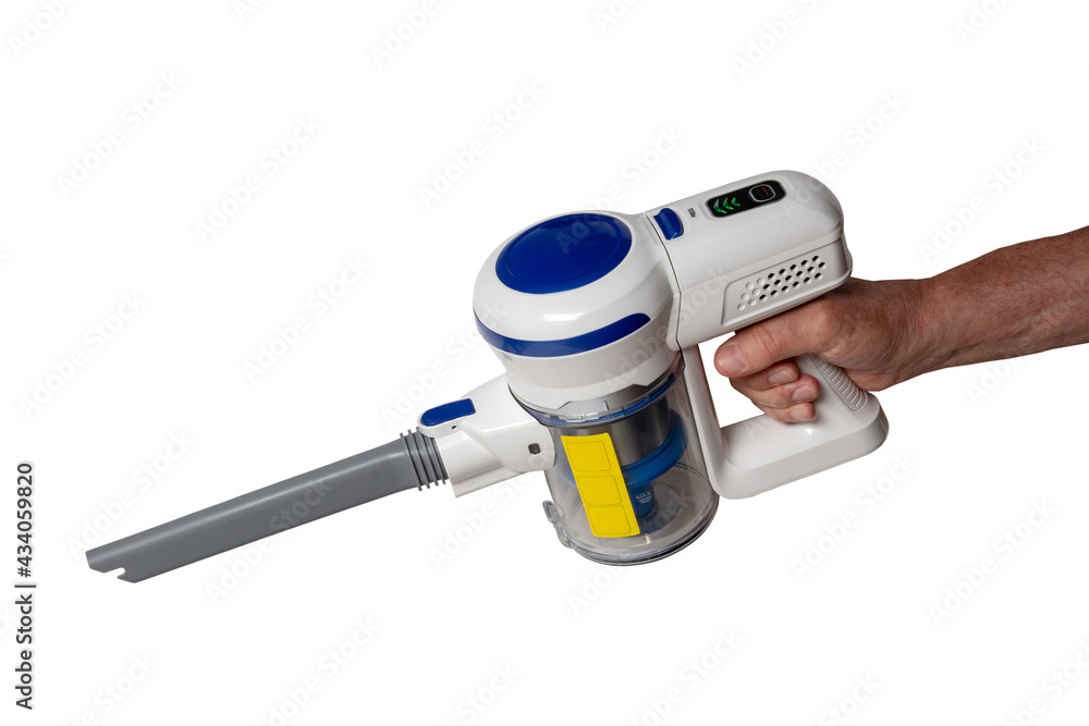 Vacuum cleaner isolated. The male hand holds hold a modern cordless