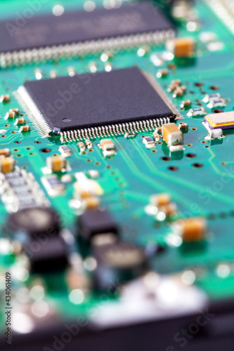 Macro shot of computer circuit board with microchip and other components