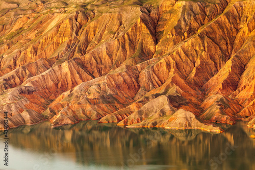 Landscape with arid eroded badlands along the Yellow river in Kanbula national forest park, Qinghai province, China photo