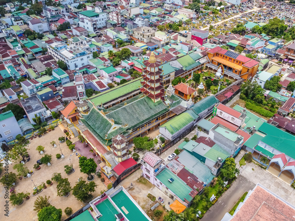 Aerial view of ancient Phuoc Hue pagoda on summer's day in Bao Loc, Vietnam, peaceful small town located on the plateau Di Linh, Lam Dong province