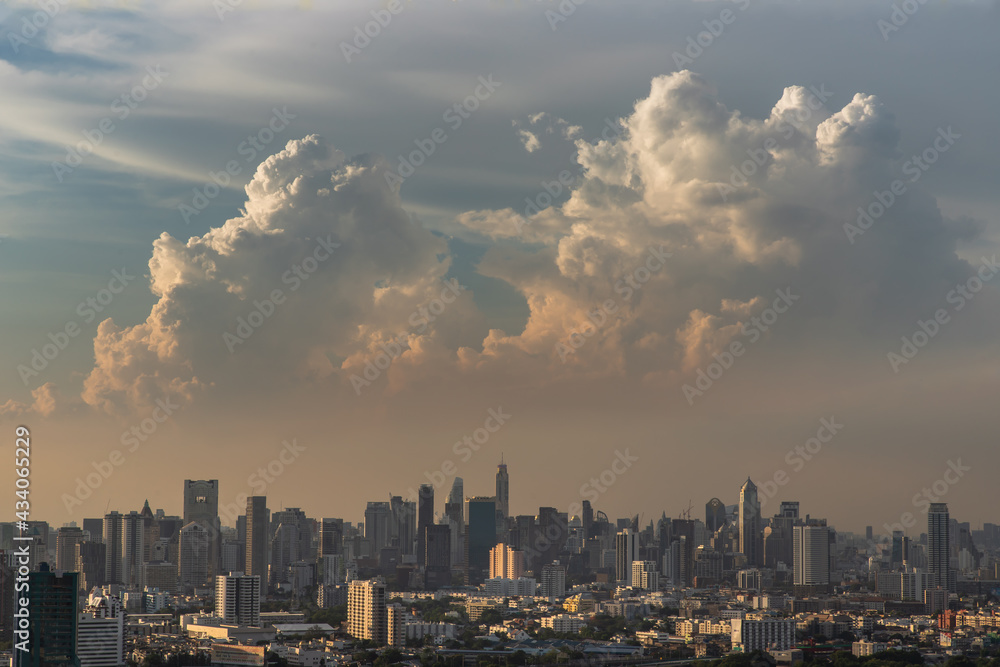 Fototapeta premium Bangkok, Thailand - May 09, 2021 : Aerial view of Beautiful scenery view of Skyscraper Evening time before Sunset creates relaxing feeling for the rest of the day. Selective focus.