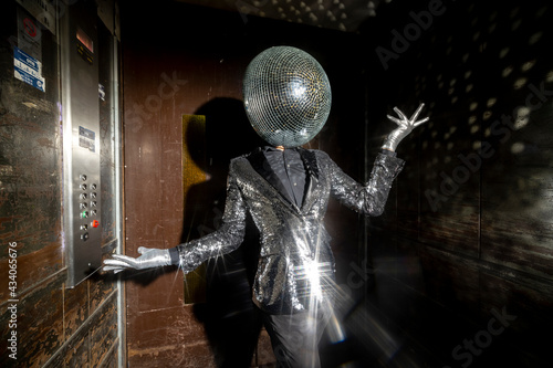 Mr disco ball dancing in a lift photo
