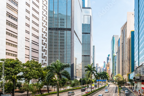Business district of Hong Kong City, street traffic and modern skyscraper buildings