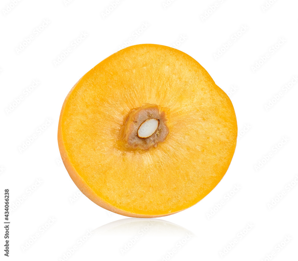 half of ripe yellow peach on white half of ripe yellow peach on white