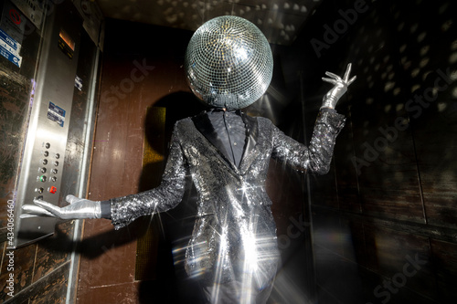 Mr disco ball dancing in a lift