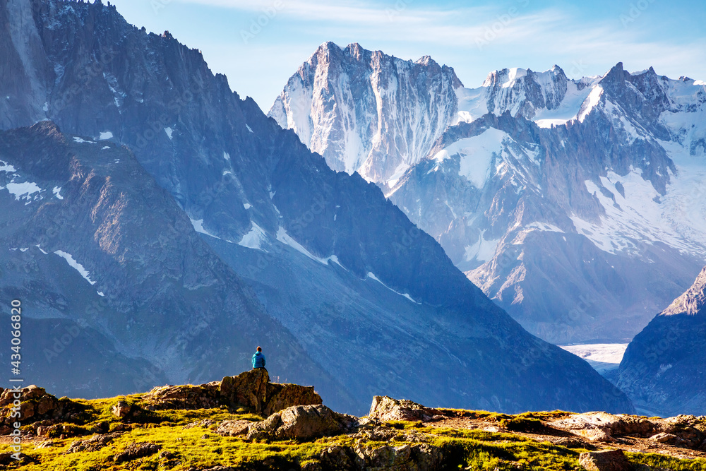 Panorama of snowy peaks on a sunny day. Location place Mont Blanc glacier, Chamonix resort, France, Europe.