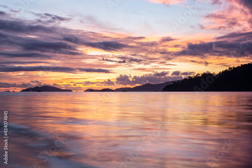 sunset view with twilight sky of Sunset beach of Lipe island, Thailand. Lipe island is known as Maldives of Thailand because there beautiful beach with clear sea water and fantastic coral reef