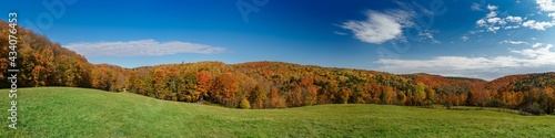 Panorama view of the colorful foliage in the secluded hill during autumn. Vermont, United States 