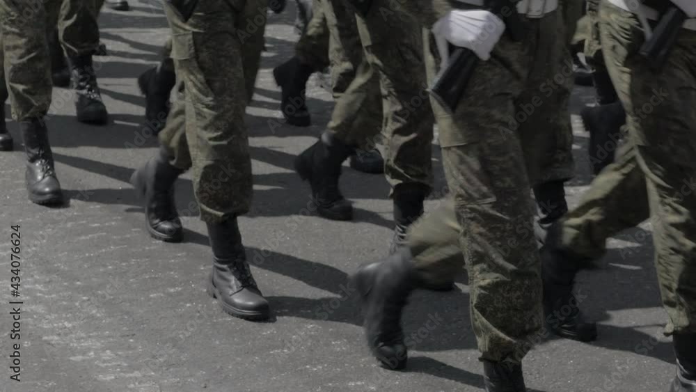 A special forces unit marching through the square. Only the legs are visible in the frame. A special forces unit marching through the square. Only the legs are visible in the frame.