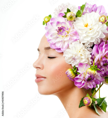 fashion model with large hairstyle and flowers in her hair.