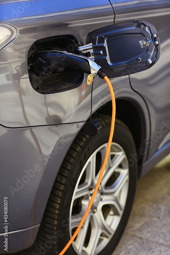 electric car refueling, technology green transport energy concept in city