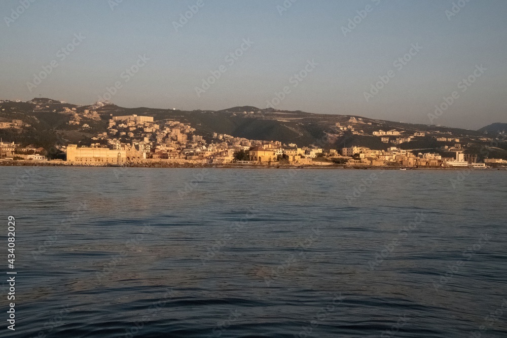 Lebanon city of Batroun viewed from the sea in a distance
