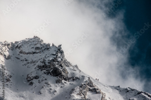 climbers go to the summit captured on low angle lense © DenisLubsanov
