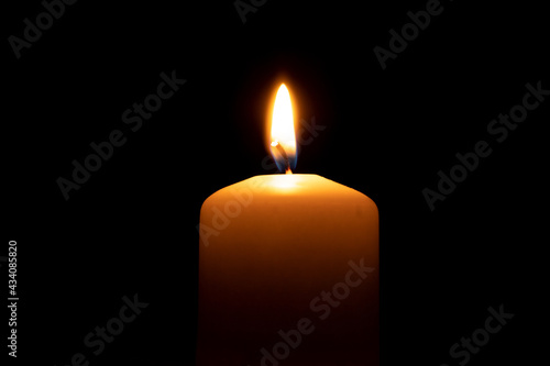 Fire candles on a black background, side view
