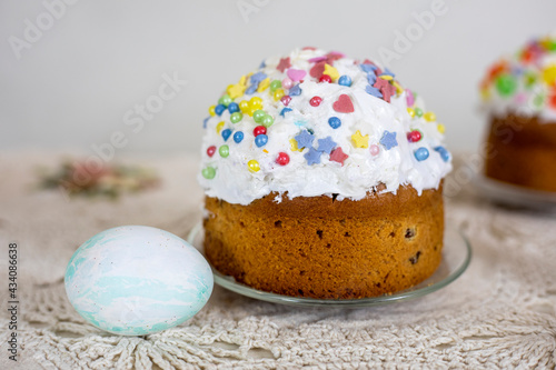 Easter cakes with Easter eggs on a vintage tablecloth, preparation for the holiday.
