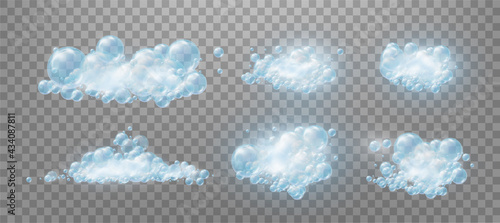 Realistic set blue foam soap with bubbles of soapy water. Design elements for washing powder, shampoo, skin cosmetics..Isolated on a transparent background.
