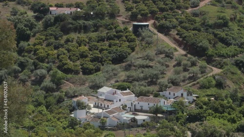 White houses in an Andalusian farmhouse in the Axarquia of Malaga on a sunny day