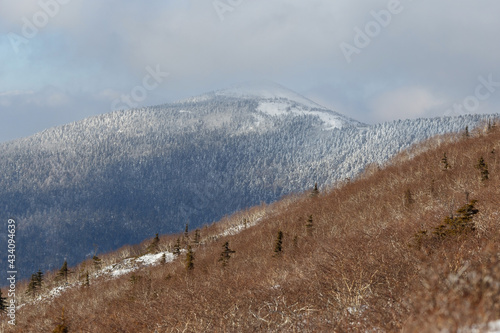 The snowy peaks of the Sestra mountain in the Lazovsky district of the Primorsky Territory. Beautiful mountain landscape. photo