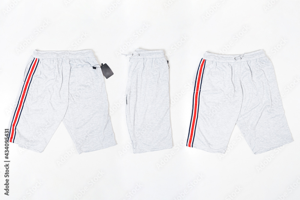 Men's short white training pants isolated on white background. Lotto