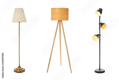 Set with different stylish floor lamps on white background