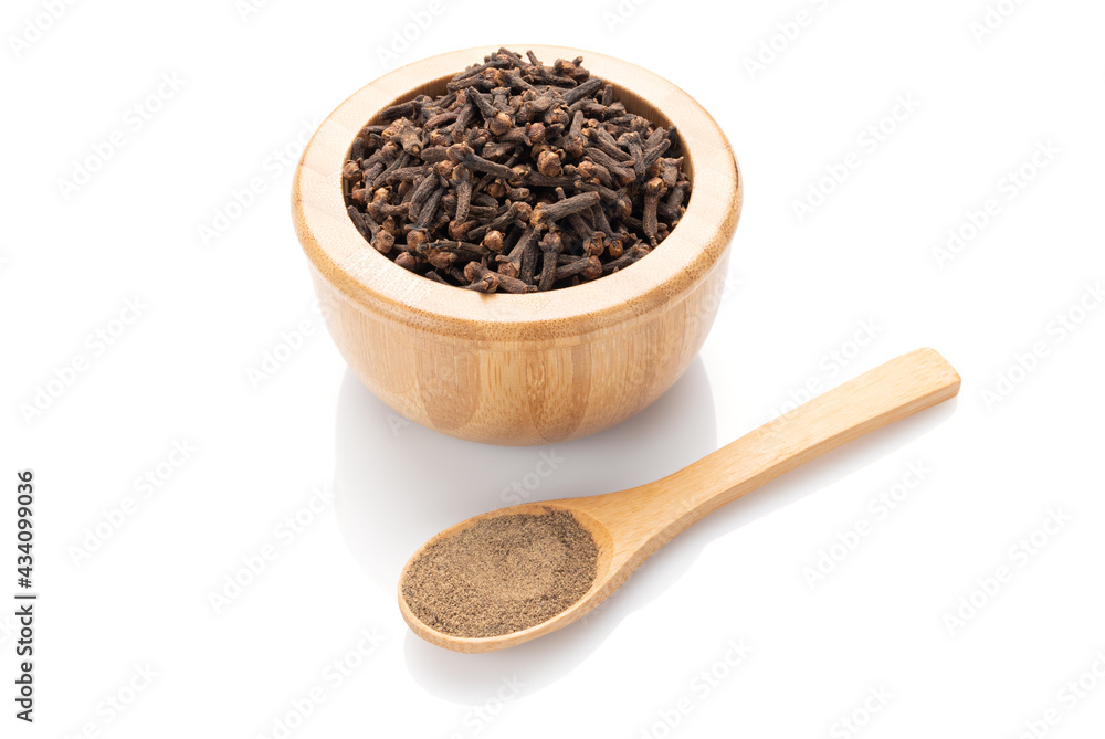 Seasoning cloves is in a wooden small bowl and Seasoning cloves is in a wooden small bowl and