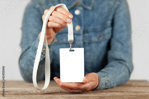 Name badge in people hands. Personal security identification, mockup. photo